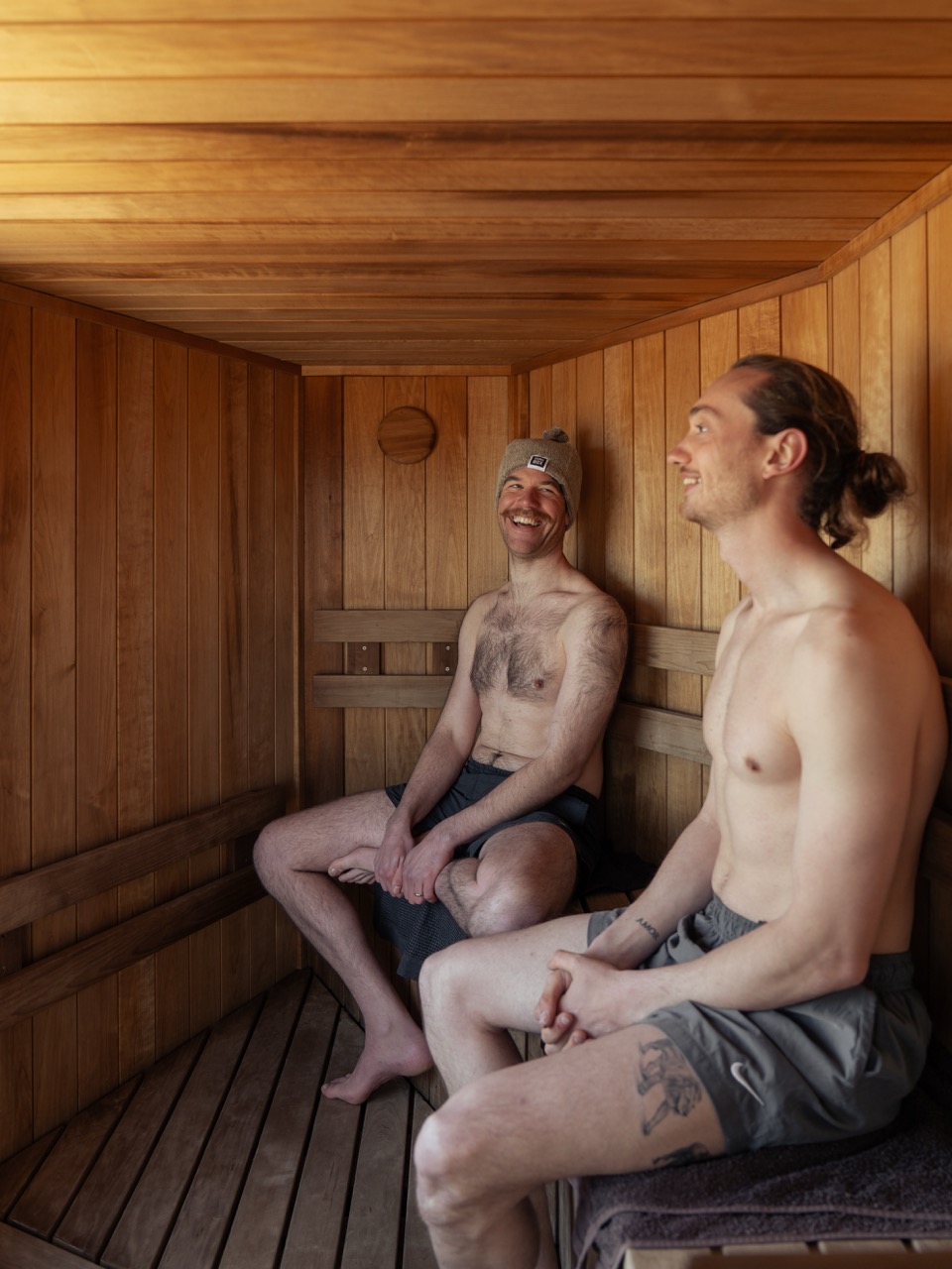People gathered together around a Sauna Box community sauna